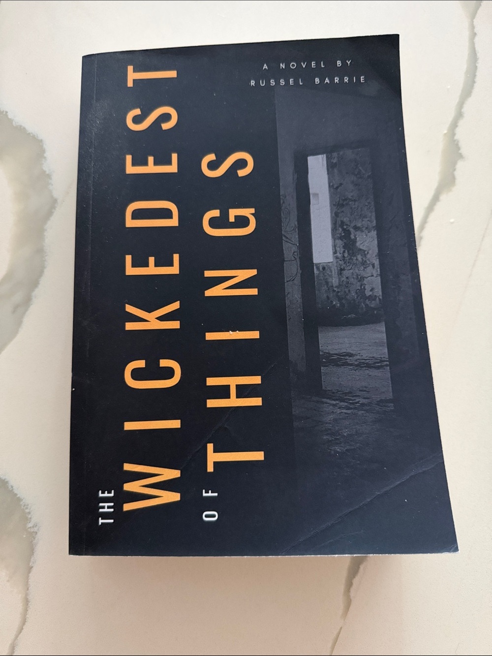 The Wickedest of Things — Black and Orange Paperback